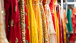 © Generative AI - Hanging beautiful indian dresses different colors and decoration at market shop boutique bazaar fashion clothes designer collection : Generative AI