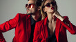© Generative AI - collage of fashionable couple in red blazers and sunglasses posing isolated on grey horizontal image : Generative AI