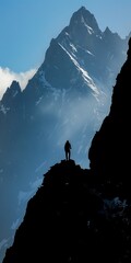 Sticker - Majestic silhouette of a person hiking to the summit of a mountain.