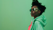 © Generative AI - Fashion clothes style and black woman with green rap gen z or hip hop aesthetic outfit for cool edgy or fashionable look Designer brand apparel attitude or teen fashion model on green  : Generative AI