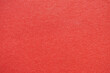 © JK_kyoto - Close-up view of bright red textured paper, perfect for backgrounds or graphic design projects.