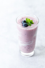 Wall Mural - Blueberry smoothie with yogurt in a glass.