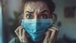 © Zahid - An American woman wearing a medical mask appears scared, frightened, and paranoid due to her concern over viral pandemic illness.
