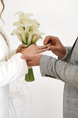 Wall Mural - During the wedding ceremony, the newlyweds exchange wedding rings.