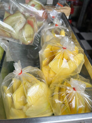 Poster - close up mango fruit in plastic bag in market