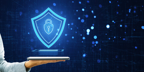 Poster - A digital cybersecurity shield floating above a tablet, held by a person against a circuitry background, concept of digital protection