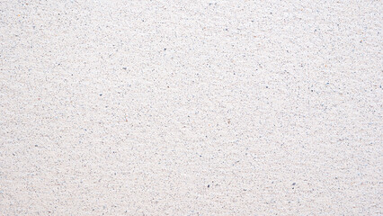 Leinwandbilder - A white wall with a pattern of small dots. The wall is plain and unadorned. The dots are evenly spaced and cover the entire surface of the wall. The wall appears to be made of a smooth