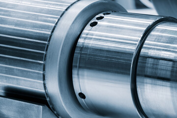 Poster - A silver metal tube with a lot of holes in it. The tube is very shiny and looks like it is made of metal