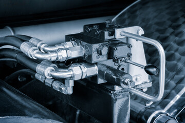 Poster - Part of a hydraulic industrial machine, control levers of a hydraulic machine, industrial concept