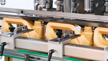 Poster - The machine produces plastic canister bottles for filling oil, paint and other chemical liquids