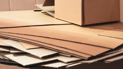 Poster - cardboard is neatly placed in a stack for further use