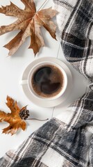 Wall Mural - Flat lay plaid and cup of coffee on white desk. Hygge, autumn cozy mood, comfort concept. Flat lay, top view 