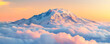 © seksun - The summit of a snow-covered mountain rising above a sea of clouds, bathed in the golden light of dawn or dusk