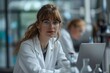 © Jane_S - Two female doctors reviewing information on a tablet in a laboratory.
