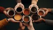 © Muzamil - Anonymous diverse hands holding a variety of coffee cups.
