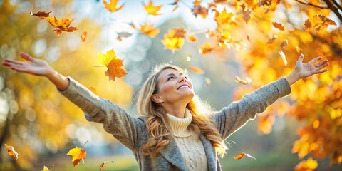 A cheerful woman enjoys a beautiful autumn day, standing amidst falling leaves with outstretched arms, smiling and embracing the vibrant colors and crisp air. 