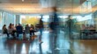 © sadewotito - Blurry Motion in a Glass-Walled Office
