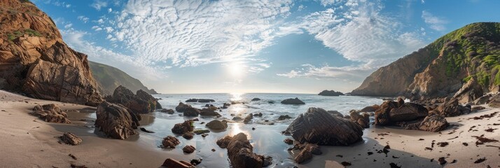 Wall Mural - A picturesque view of a secluded beach cove surrounded by rocky cliffs, tide pools, and a calm ocean. Soft sunlight filters through the clouds creating a warm and inviting atmosphere