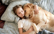 © Ievgen Skrypko - Cute Little Girl Sleeping With Dog In Embrace In Bed