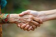 © Hanna - Two hands shaking hands, one of which is older