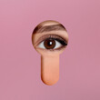 © New Africa - Woman looking through keyhole in dark pink surface