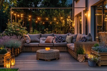 Wall Mural - Summer evening on the terrace of beautiful suburban house with patio with wicker furniture and lights