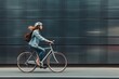 © gearstd - A cyclist wearing a helmet and a backpack rides a bicycle swiftly along a city street, with a blurred background emphasizing the motion and urban environment.