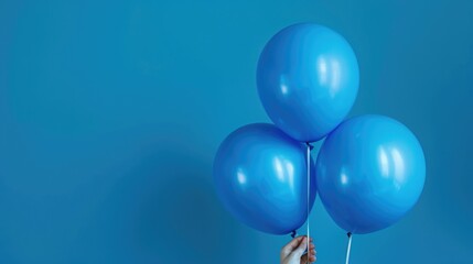 Wall Mural - A person holding a bunch of blue balloons