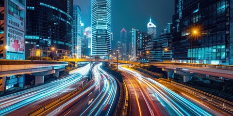 Poster - A busy city street at night with vibrant light trails from cars and buildings