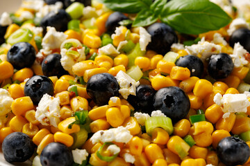 Wall Mural - Blueberry Corn Feta Salad in white plate on wooden table. Healthy food