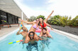 © ADDICTIVE STOCK - Multiethnic friends enjoying a fun pool party