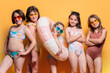 © ADDICTIVE STOCK - Group of children in swimwear with summer props in studio