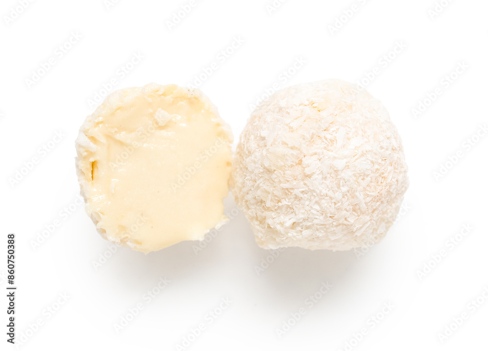 Delicious chocolate candies with coconut topping isolated on white background