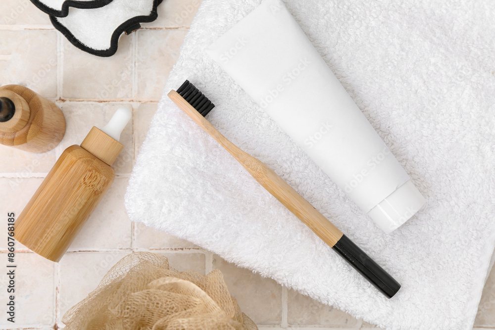 Set of bath supplies and cosmetics on light tile table