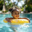 © Ace64 Studio - black overjoyed laughing smiling exited child in swimming pool floating on swimming ring, Little girl having fun on family summer vacation in tropical hotel resort, tourism
