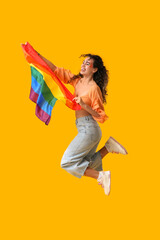 Poster - Young African-American woman with rainbow flag jumping on yellow background. LGBT concept