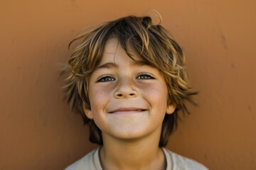 Wall Mural - Little Boy Smiling Happiness Playful Portrait Closeup Copy Space