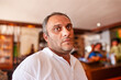 © poco_bw - Egyptian adult male mid age wearing casual clothing in a room with a cozy atmosphere