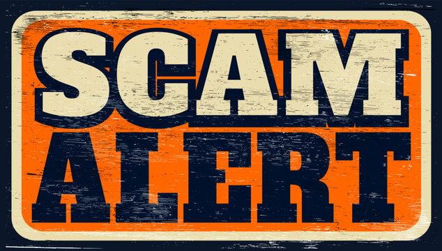 Aged and worn scam alert sign on wood