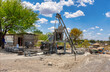 © poco_bw - brick making machine in the village township, small african business