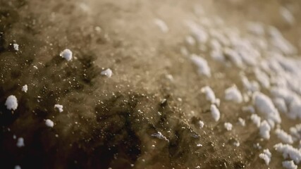 Poster - Ore mining in winter. Stock footage. Close-up of hot fossil releases steam on surface of earth. Extracted pile of mineral releases steam on winter day at quarry