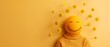 © nattapon98 - Yellow smiley face in a cozy sweater surrounded by flowers on a vibrant yellow background, symbolizing happiness and positivity.