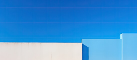 Wall Mural - Modern building wall against blue sky creates an abstract architectural background with copy space image.