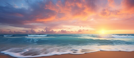Wall Mural - Sunrise over a serene beach with a scenic seascape and fluffy clouds in the sky, perfect for a summer vacation with a peaceful ambiance and copy space image.