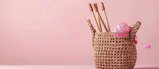 Poster - Handmade and craft. Crochet brown bag with crochet work. Yarn and wood crochet needles on pastel background. with copy space image. Place for adding text or design