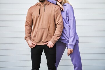 Wall Mural - Urban Fashion Mockup with Couple in Plain Hoodies