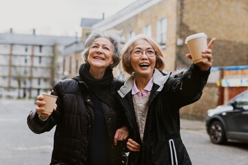 Friends drinking coffee from paper cups