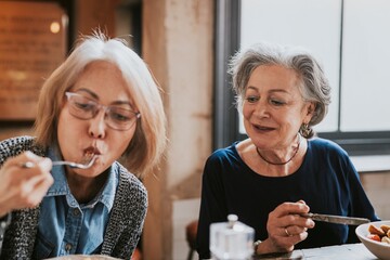 Sticker - Diverse friends eating lunch at restaurant