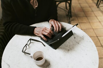 Sticker - Man working on digital tablet at coffee shop