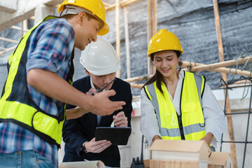 Wall Mural - Group architect team on construction site inspection documents and business workflow in the morning.